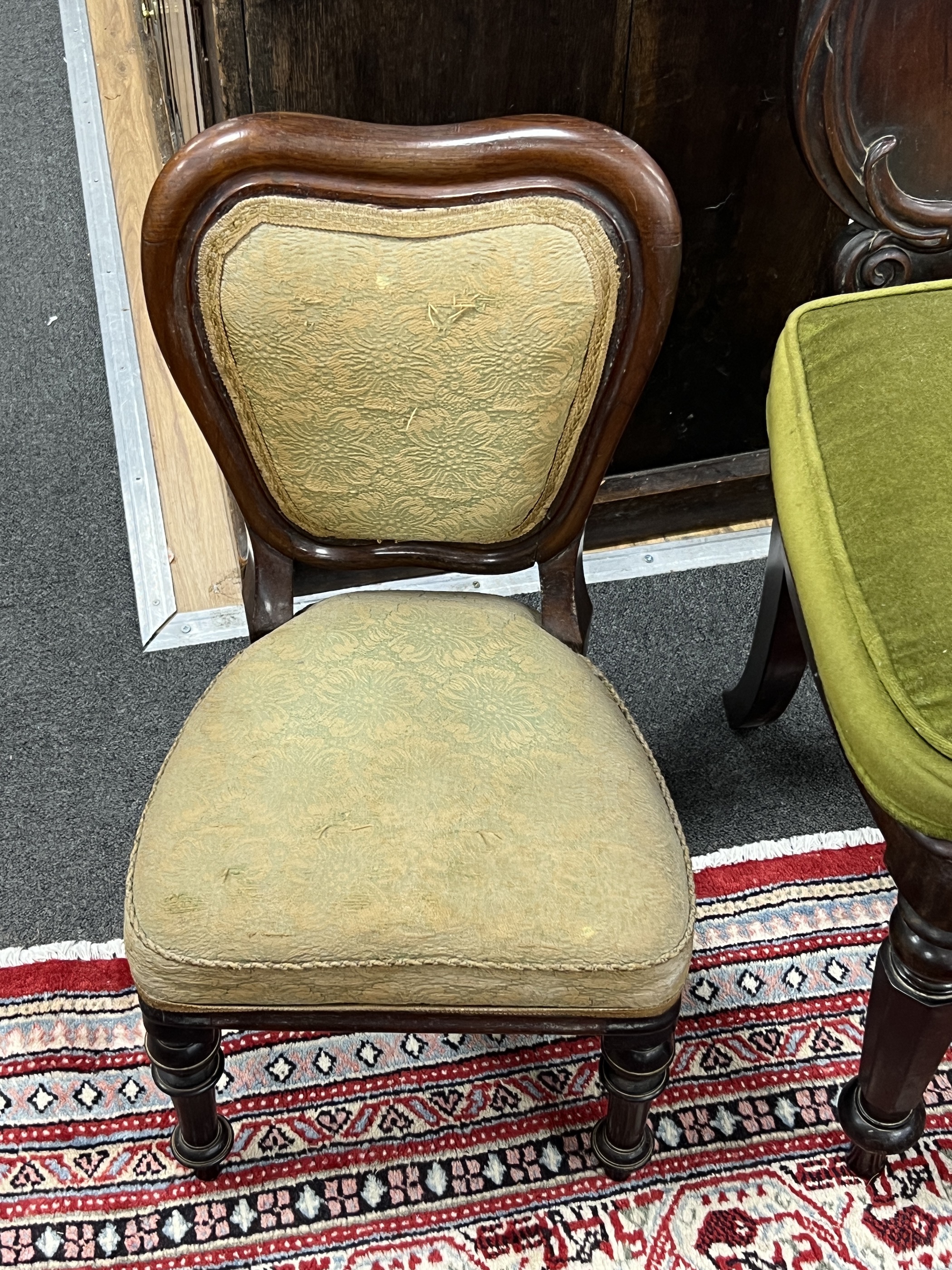 A Victorian carved mahogany hall chair and a Victorian mahogany child's chair